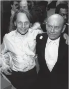  ?? (AP photo/ Mitchell Tapper) ?? Actor Yul Brynner, right, poses with son, Rock Brynner, at the opening of the Hard Rock Cafe in New York on March 13, 1984. Rock was the night manager.