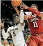  ?? [AP PHOTO] ?? Baylor’s Johnathan Motley, left, and Oklahoma’s Kristian Doolittle battle for a rebound during Tuesday night’s Big 12 basketball game in Waco, Texas.