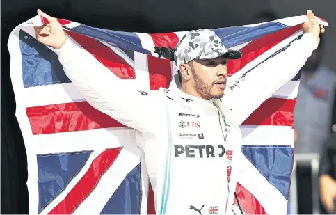  ??  ?? Lewis Hamilton celebrates after winning his sixth world title at the US Grand Prix.