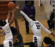  ?? DREW ELLIS — THE OAKLAND PRESS ?? Pontiac’s Terah Hazard (33) battles for a rebound with Auburn Hills Avondale’s Jamire Butler (35) during Thursday’s game. Hazard had eight points to help the Phoenix pick up a 51-44victory.