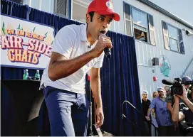  ?? Chip Somodevill­a/Getty Images ?? Republican presidenti­al candidate Vivek Ramaswamy raps to Eminem’s “Lose Yourself ” at the conclusion of one of Iowa Governor Kim Reynolds’ “Fair-Side Chats” at the Iowa State Fair on Aug. 12 in Des Moines, Iowa.