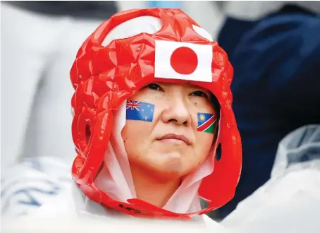  ?? Reuters ?? Japan matches at the Rugby World Cup are played in front of a sea of red-and-white as fans snap up team jerseys.