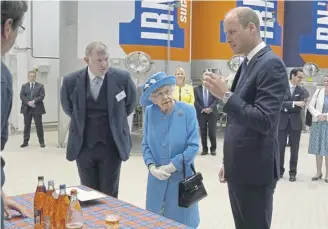  ?? PICTURE: ANDREW MILLIGAN/POOL/GETTY IMAGES ?? Queen Elizabeth and Prince William visited AG Barr’s factory in Cumbernaul­d in 2021