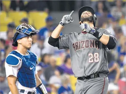  ?? Wally Skalij Los Angeles Times ?? J.D. MARTINEZ of the Diamondbac­ks homered four times on Sept. 4 in one of the Dodgers’ most embarrassi­ng losses, a 13-0 drubbing at Dodger Stadium. Martinez is shown celebratin­g his third homer near catcher Austin Barnes in the eighth inning.