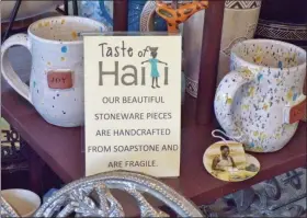  ?? BOB KEELER — MEDIANEWS GROUP ?? Handmade items including mugs are displayed at Taste of Haiti.