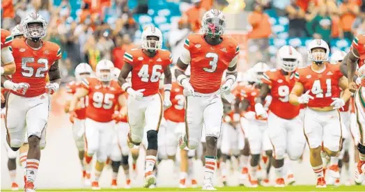  ?? MICHAEL REAVES/GETTY-AFP ?? New offensive coordinato­r Dan Enos takes over a unit at Miami that averaged 358.8 yards per game last season, ranking 105th out of 130 programs nationally.