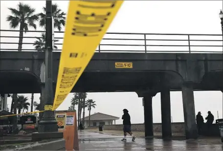  ?? Christina House Los Angeles Times ?? THE HUNTINGTON BEACH Pier was among closures made by local officials after crowds turned up at parks and beaches this weekend.