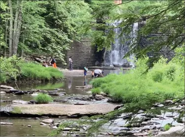  ?? TANIA BARRICKLO — DAILY FREEMAN ?? People cool off at the Little Deep swimming hole in Woodstock, N.Y., on Wednesday, June 10, despite the town declaring it closed.