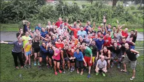  ?? SUBMITTED PHOTO ?? The entire Conshy Running Club poses for a fun photo outside of the entrance to the Schyulkill River Trail by Conshohock­en Brewing Co.