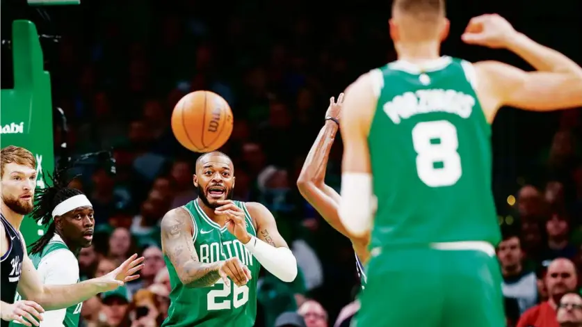  ?? ERIN CLARK/GLOBE STAFF ?? Celtics forward Xavier Tillman provided a welcome spark off the bench, hitting a much-needed 3-pointer in the first quarter before draining the winning shot with seven seconds to play.