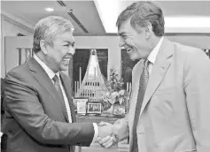  ??  ?? Deputy Prime Minister Datuk Seri Dr Ahmad Zahid Hamidi with UK Minister of State for Defence Procuremen­t Philip Dunne who called on him at his office, yesterday. - Bernama photo