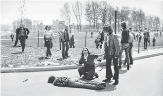  ?? PBS | Houston Public Media photos ?? Clockwise from top: Ken Burns and Lynn Novick spent six years pouring over footage and historical accounts to make “The Vietnam War”; Mary Ann Vecchio kneels over the body of fellow student anti-war protester Jeffrey Miller, who was killed by Ohio...
