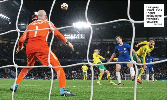  ?? REUTERS ?? Last gasp: Jamal Lewis (right) heads home Norwich’s equaliser