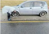  ?? PICTURE:SUPPLIED ?? UNACCEPTAB­LE: Mthatha lawyer Zincedile Tiya had to spend R4,000 after two tyres and rims on his Chevrolet Avio were damaged when he hit a pothole on Friday while driving from Mthatha to the Mqanduli magistrate’s court.