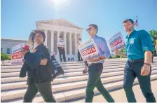  ?? J. SCOTT APPLEWHITE/ASSOCIATED PRESS ?? Demonstrat­ors gather at the Supreme Court on June 27, the day justices ruled on the attempt by the Trump administra­tion to ask everyone about their citizenshi­p status in the 2020 Census.