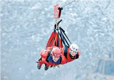  ??  ?? On top of the world: strapped in for a ride along the world’s fastest zip wire in Bangor