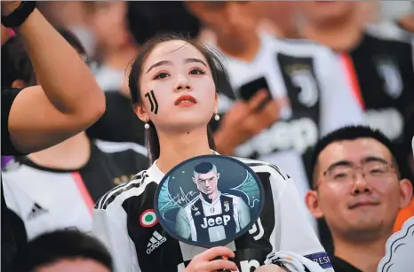  ?? JUVENTUS FC VIA GETTY IMAGES ?? Juventus fans watch the action during an Internatio­nal Champions Cup preseason match against Inter Milan at Nanjing Olympic Center Stadium in Nanjing, Jiangsu province, on July 24 last year.