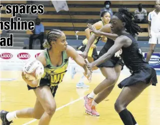  ?? (Photos: Garfield Robinson) ?? Jamaica's Shadian Hemmings (left) searches for a pass around Trinidad and Tobago's Janeisha Cassimy during game two of their three-match Sunshine Series at the National Indoor Sports Centre yesterday.