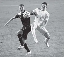  ?? PHOTOS BY DAVID SANTIAGO dsantiago@miamiheral­d.com ?? Inter Miami midfielder Matías Pellegrini, front, fights for the ball against Atlanta United’s Manuel Castro in the first half Wednesday at Inter Miami CF Stadium in Fort Lauderdale.