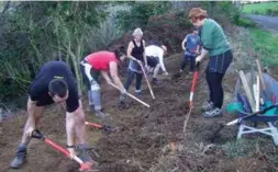  ??  ?? Outward Bound students prepare the Pathway for planting.