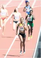  ?? RICARDO MAKYN/MULTIMEDIA PHOTO EDITOR ?? Stephenie-Ann McPherson leading Jamaica to victory in the 4x400 metres heats on Saturday.
