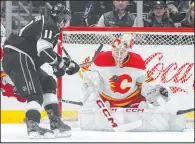  ?? Mark J. Terrill The Associated Press ?? Flames goalie Jacob Markstrom stops a shot by Kings center Anze Kopitar during the first period of Los Angeles’ 4-1 victory Thursday.