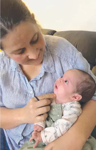  ?? ?? Sophie Banks, of Launceston, with her daughter Allie Hadland, and (inset) Allie in hospital after being resuscitat­ed following a cardiac arrest at just a few weeks of age.