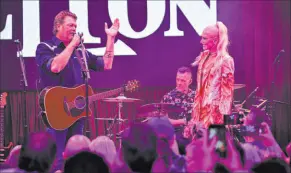  ?? Stephen Greathouse ?? Blake Shelton and Gwen Stefani appear before 400 invited guests at the grand opening of Ole Red Las Vegas on Tuesday.