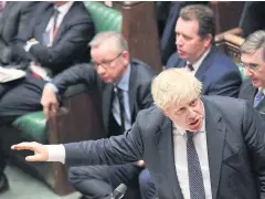  ?? AP ?? Britain’s PM Boris Johnson speaks to lawmakers inside the House of Commons during Prime Minister’s Question Time, in London on Wednesday.