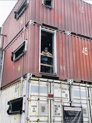  ?? TAIMY ALVAREZ/SUN SENTINEL ?? Architect Asghar Fathi stands at a window on the second level of his home he’s building.