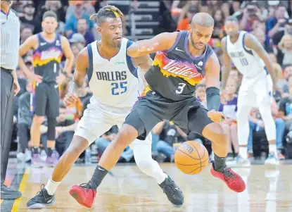 ?? AP PHOTO ?? Phoenix Suns guard Chris Paul (3) works the ball past Dallas Mavericks forward Reggie Bullock (25) during the first half of Game 2 in the second round of the NBA Western Conference playoff series Wednesday, May 4, 2022, in Phoenix.