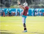  ?? TAIMY ALVAREZ/STAFF PHOTOGRAPH­ER ?? Ryan Tannehill opted not to have surgery back when he suffered partial tears to two ligaments last fall.