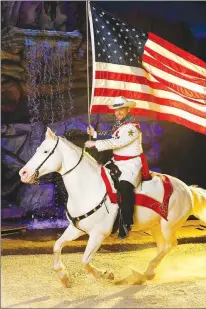  ?? (Courtesy Photo) ?? An American flag always begins the show at Dolly Parton’s Stampede in Branson.