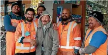  ?? PHOTO: SUPPLIED/WATERCARE ?? City Convenienc­e Store owner Reza Askari, centre, meets five of the Watercare sub-contractor­s who tackled a man to the ground after an alleged robbery at Askari’s dairy.