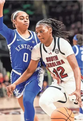  ?? JEFF BLAKE/USA TODAY SPORTS ?? South Carolina guard MiLaysia Fulwiley drives around Kentucky guard Brooklynn Miles during the teams’ first matchup this season on Jan. 15. The Gamecocks rolled on Sunday, 103-55.