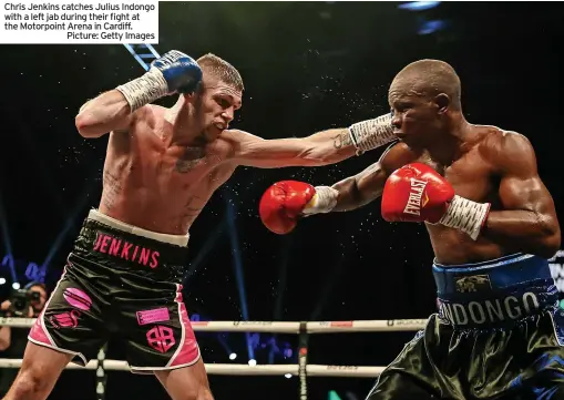  ?? ?? Chris Jenkins catches Julius Indongo with a left jab during their fight at the Motorpoint Arena in Cardiff.
Picture: Getty Images