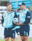  ??  ?? NSW pair Tariq Sims and Paul Vaughan are among five Dragons players on Origin duty.