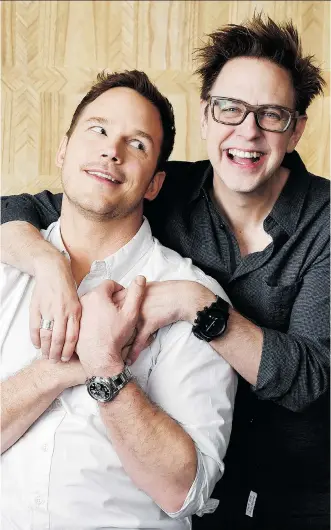  ?? CHRIS PIZZELLO/THE ASSOCIATED PRESS ?? Chris Pratt, left, star of Guardians of the Galaxy Vol. 2, is embraced by the film’s director, James Gunn, who jokes the studio insisted on a “beefcake clause.” The film opens Friday.