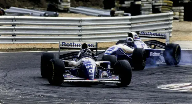  ??  ?? In Portugal in 1994 Hill claimed a third successive win and was joined on the podium for the first time by Coulthard