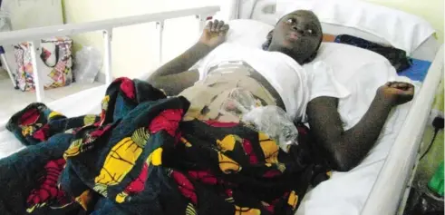  ??  ?? Deborah Stephen, who was shot at by armed robbers, at the National Hospital Abuja yesterday.