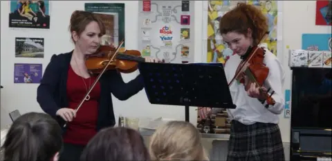  ??  ?? Violin tutor Emer Collins with second year student Ria Murphy playing the viola.
