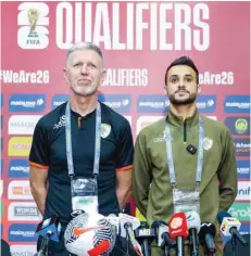  ?? ?? Oman head coach Jaroslav Silhavy with player Ali al Busaidy.