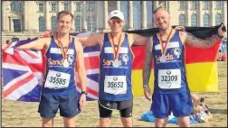  ??  ?? Craig Sharp, Jethro Setchfield and Mark Purvey, of Poplar Runners, competed in the Berlin Marathon for charity Sands.