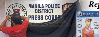  ?? KRIZJOHN ROSALES ?? A black cloth is placed over the signage of the Manila Police District Press Corps office to condemn the killing of journalist Alex Balcoba, who was gunned down in Quiapo, Manila on Friday. Inset shows Balcoba’s press ID.