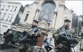  ?? PHOTO: GETTY IMAGES ?? Soldiers stand guard in front a synagogue in Lille, northern France
