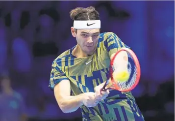  ?? ANTONIO CALANNI AP ?? Taylor Fritz returns the ball to Rafael Nadal during their singles match of the ATP World Tour Finals.