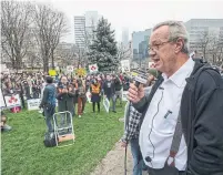  ?? FRANK GUNN THE CANADIAN PRESS ?? Ontario Independen­t MPP Randy Hillier speaks to anti-lockdown protesters at the Ontario legislatur­e Thursday. Data shows community spread remains high in Toronto, with public health officials unable to trace 70 per cent of cases.