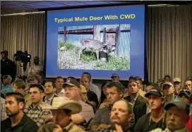  ?? JAY JANNER / AMERICAN-STATESMAN ?? Concerned deer breeders and ranch owners listen during a meeting of the Texas Parks and Wildlife Department Commission in 2015 about chronic wasting disease. A total of 50 cases of the disease have been documented in Texas.