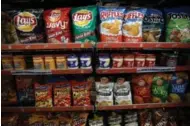  ?? JUSTIN SULLIVAN/GETTY IMAGES FILE PHOTO ?? Frito-Lay, the maker of Lay’s and Doritos, hopes its all-natural Simply line helps its products reach new, organic-food shoppers.