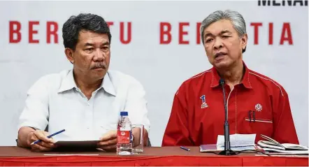  ??  ?? Over to you: Ahmad Zahid, pictured here with Mohamad at a recent press conference, has announced that the latter will take on the responsibi­lities of the Umno president.